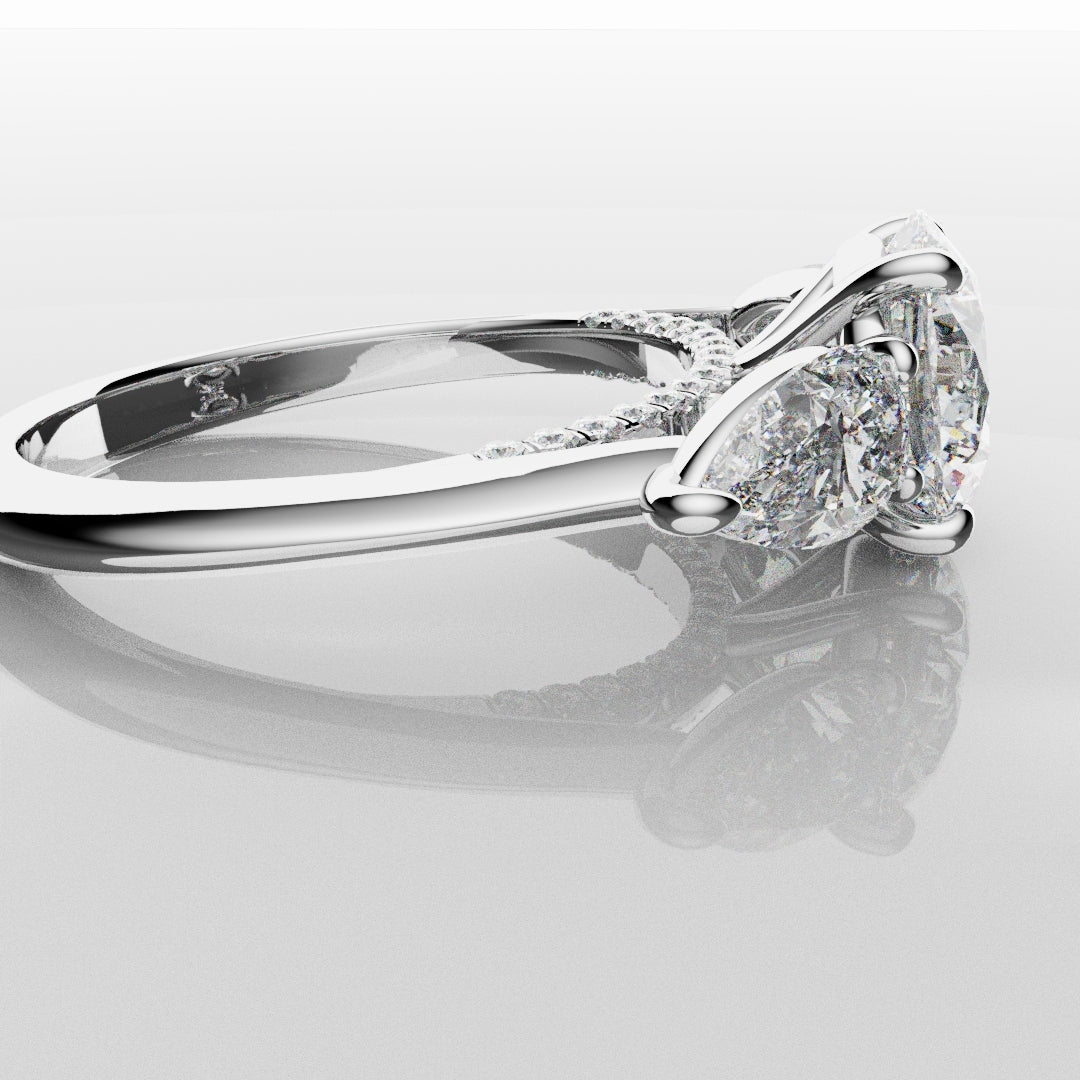 Round and Pear Trilogy Engagement Ring with Diamond Set Cathedral