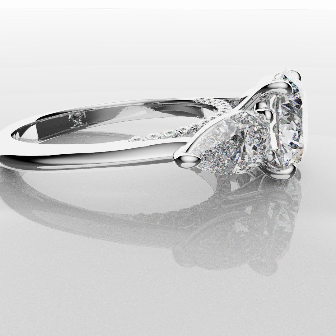 Round and Pear Trilogy Engagement Ring with Diamond Set Cathedral