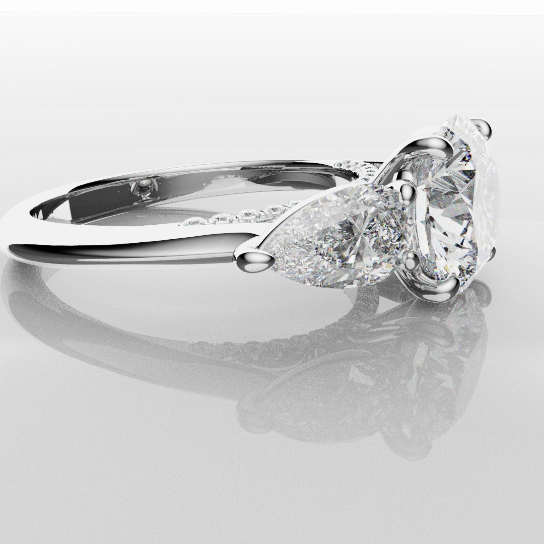 Round and Pear Trilogy Engagement Ring with Diamond Set Cathedral