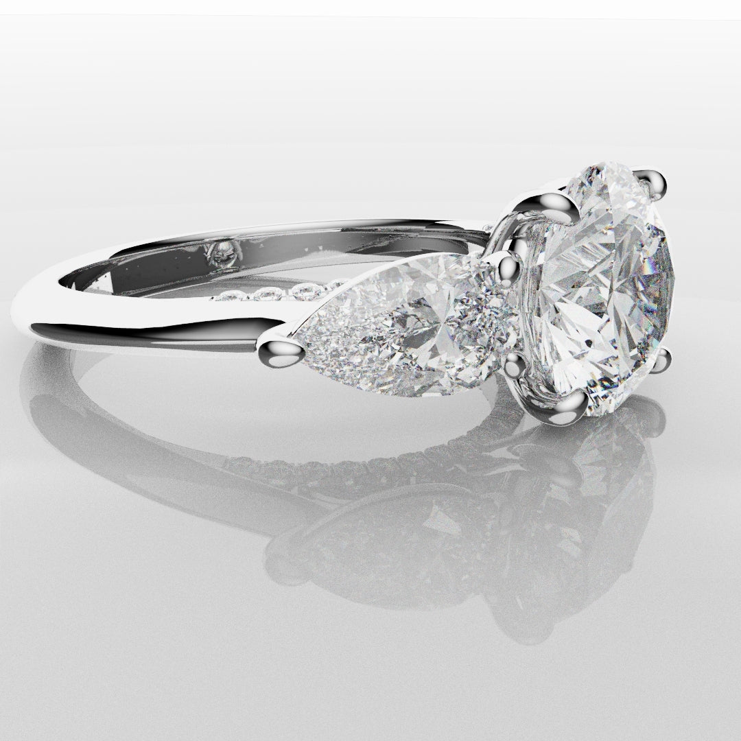 Round and Pear Trilogy Engagement Ring with Diamond Set Cathedral