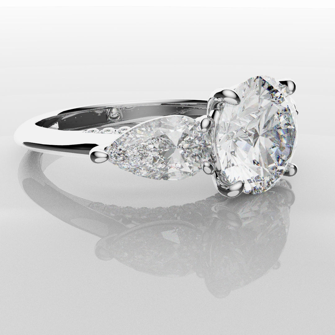 Round and Pear Trilogy Engagement Ring with Diamond Set Cathedral