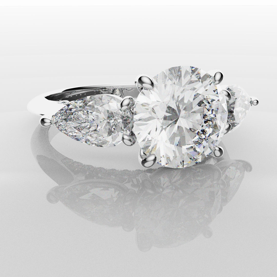 Round and Pear Trilogy Engagement Ring with Diamond Set Cathedral