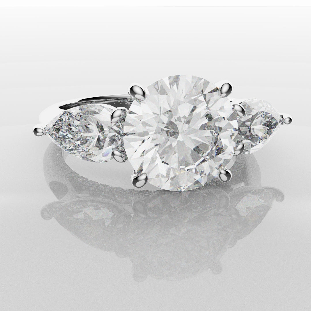 Round and Pear Trilogy Engagement Ring with Diamond Set Cathedral