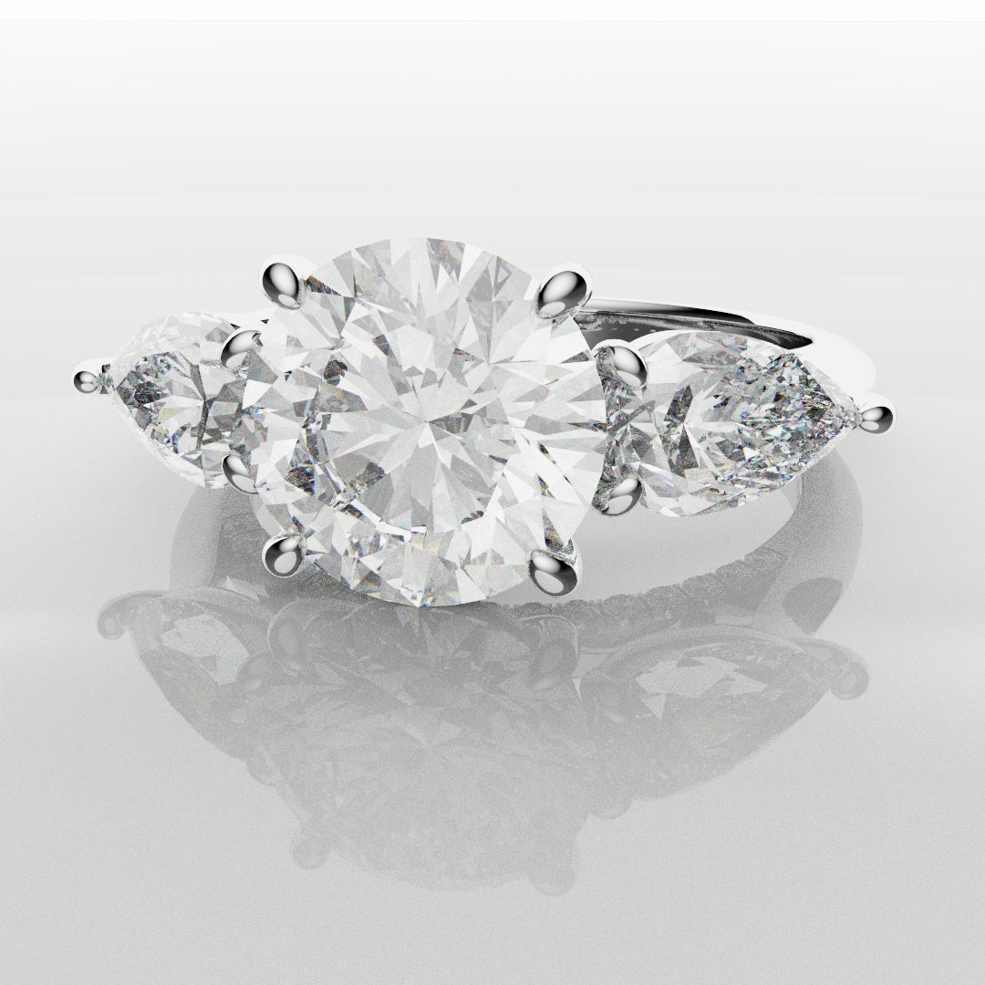 Round and Pear Trilogy Engagement Ring with Diamond Set Cathedral