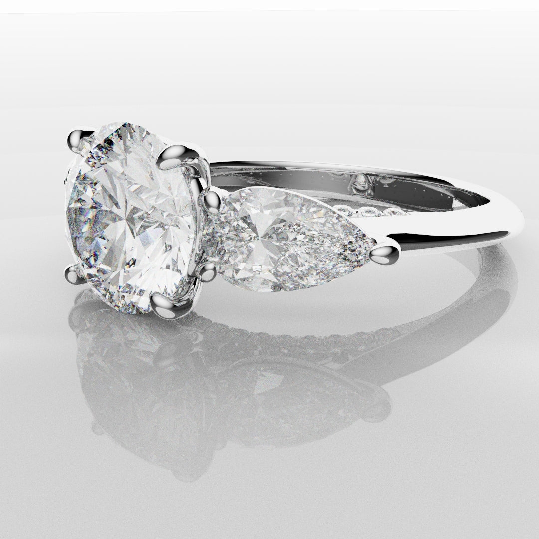 Round and Pear Trilogy Engagement Ring with Diamond Set Cathedral