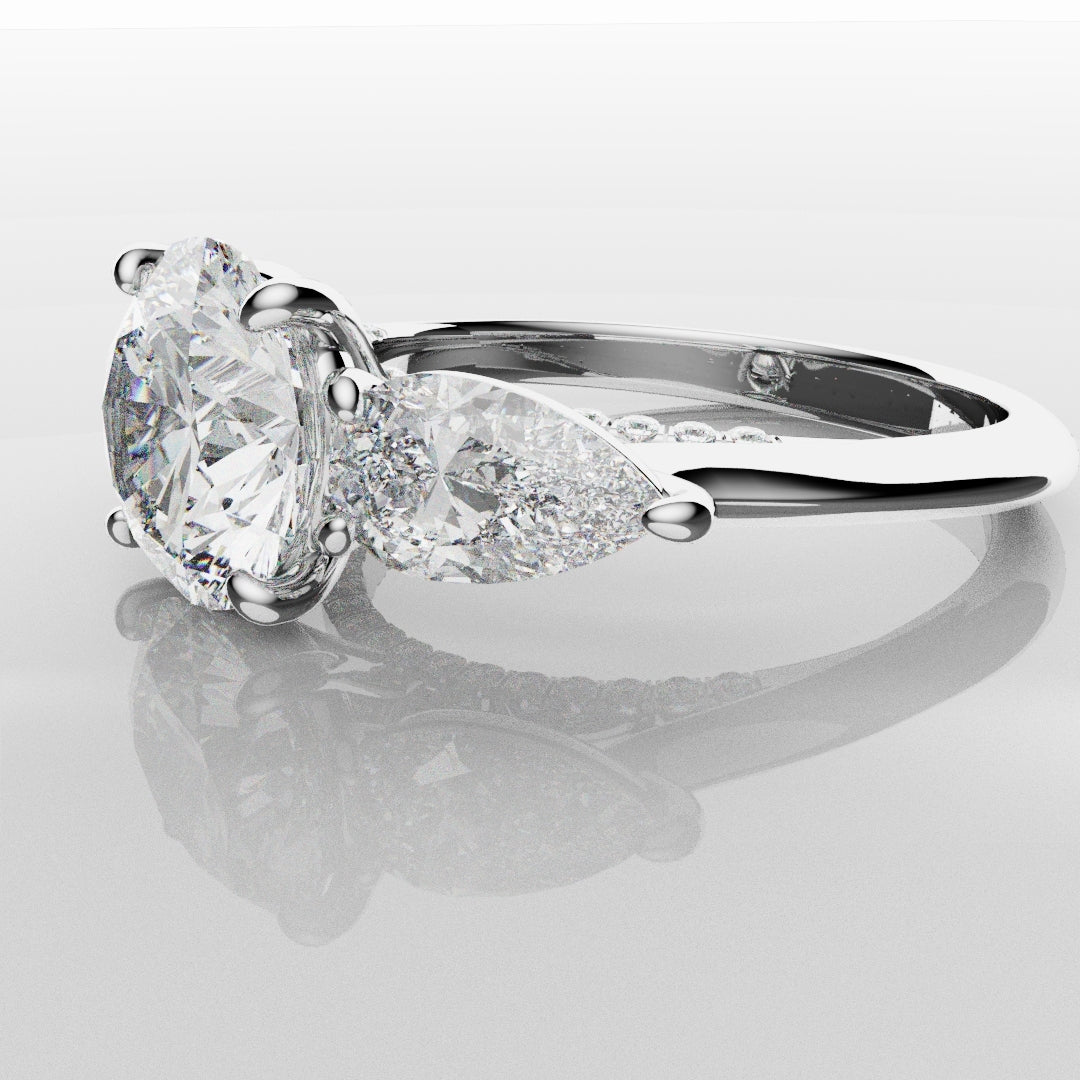 Round and Pear Trilogy Engagement Ring with Diamond Set Cathedral
