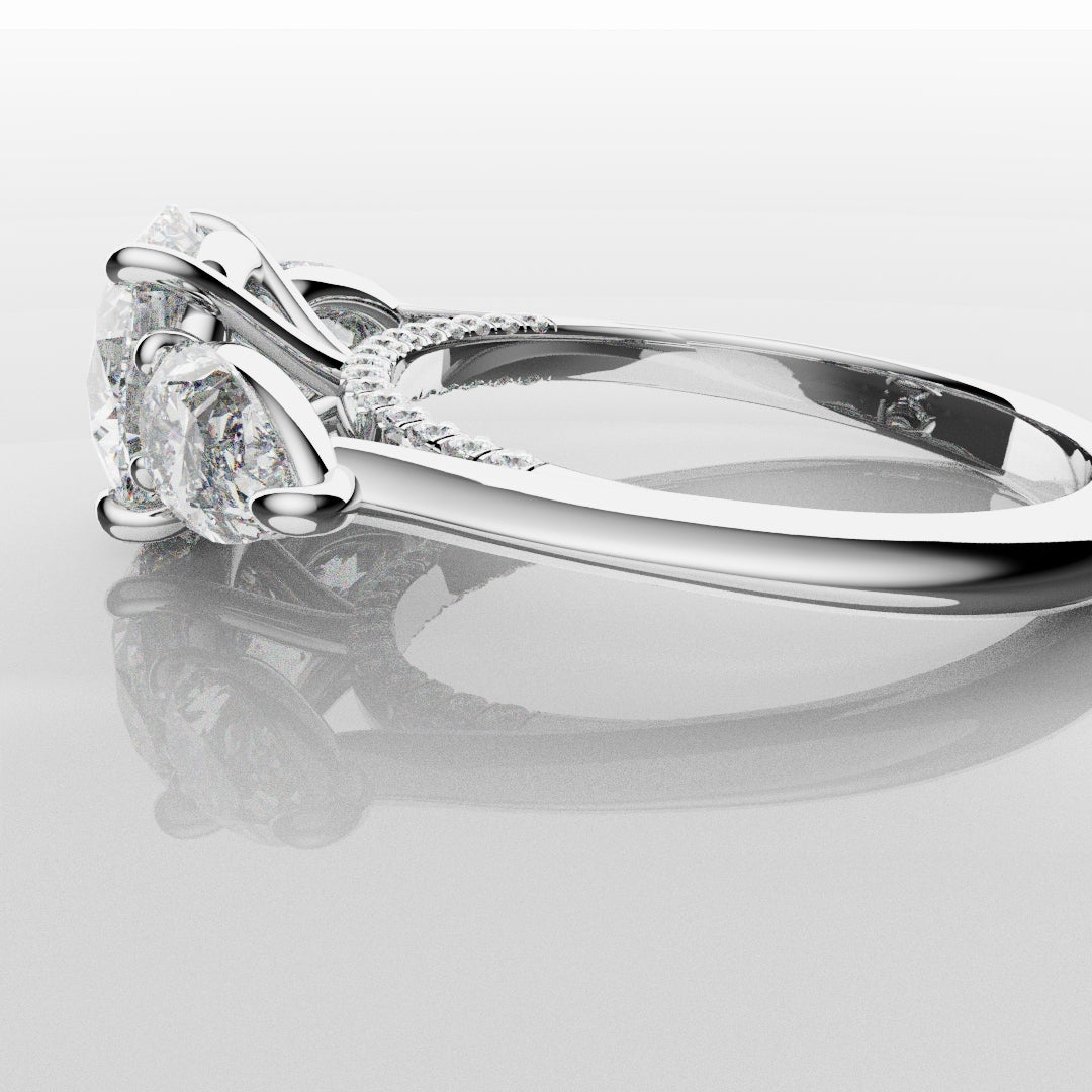 Round and Pear Trilogy Engagement Ring with Diamond Set Cathedral
