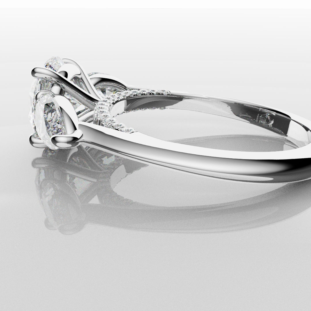 Round and Pear Trilogy Engagement Ring with Diamond Set Cathedral