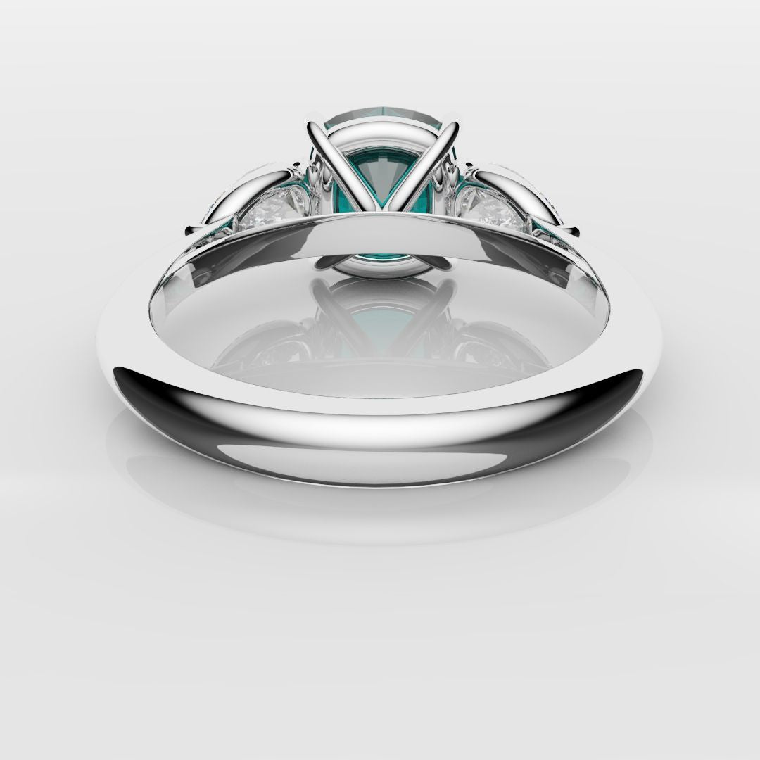 cushion cut teal sapphire and pear shaped diamond trilogy engagement ring