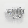 emerald cut three stone engagement ring