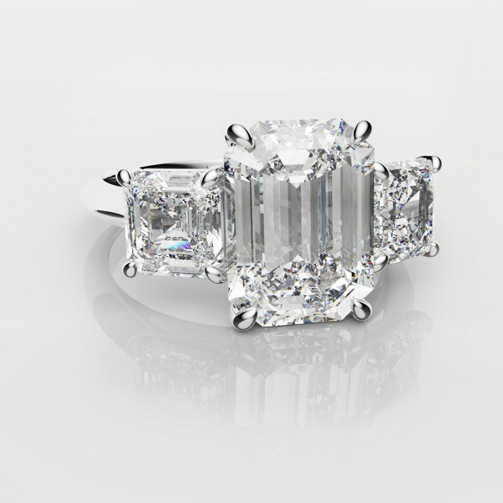 emerald cut three stone engagement ring
