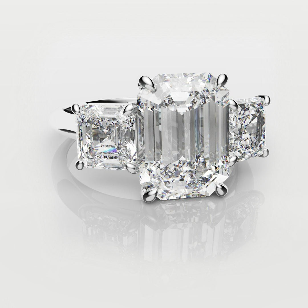 emerald cut three stone engagement ring
