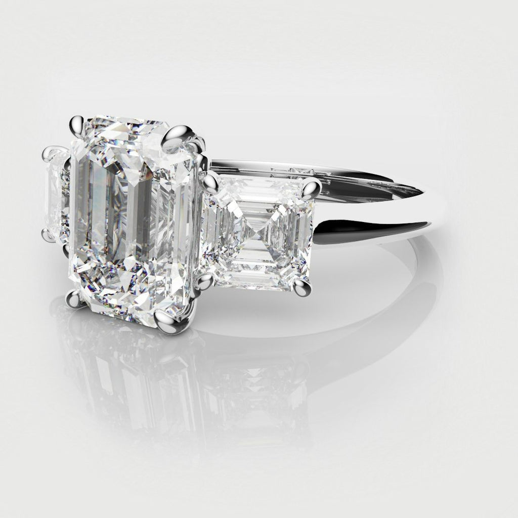 emerald and asscher cut diamond three stone engagement ring