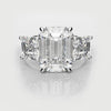 emerald cut trilogy engagement ring