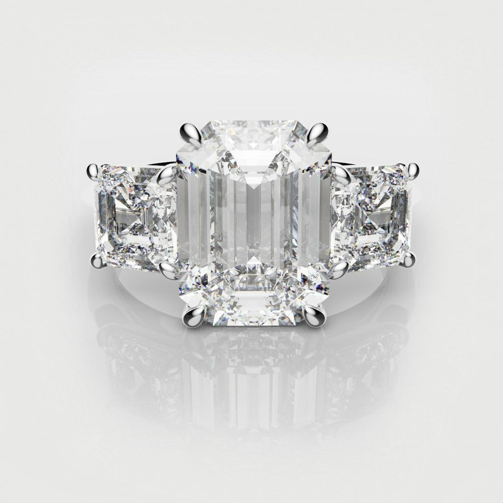 emerald cut trilogy engagement ring