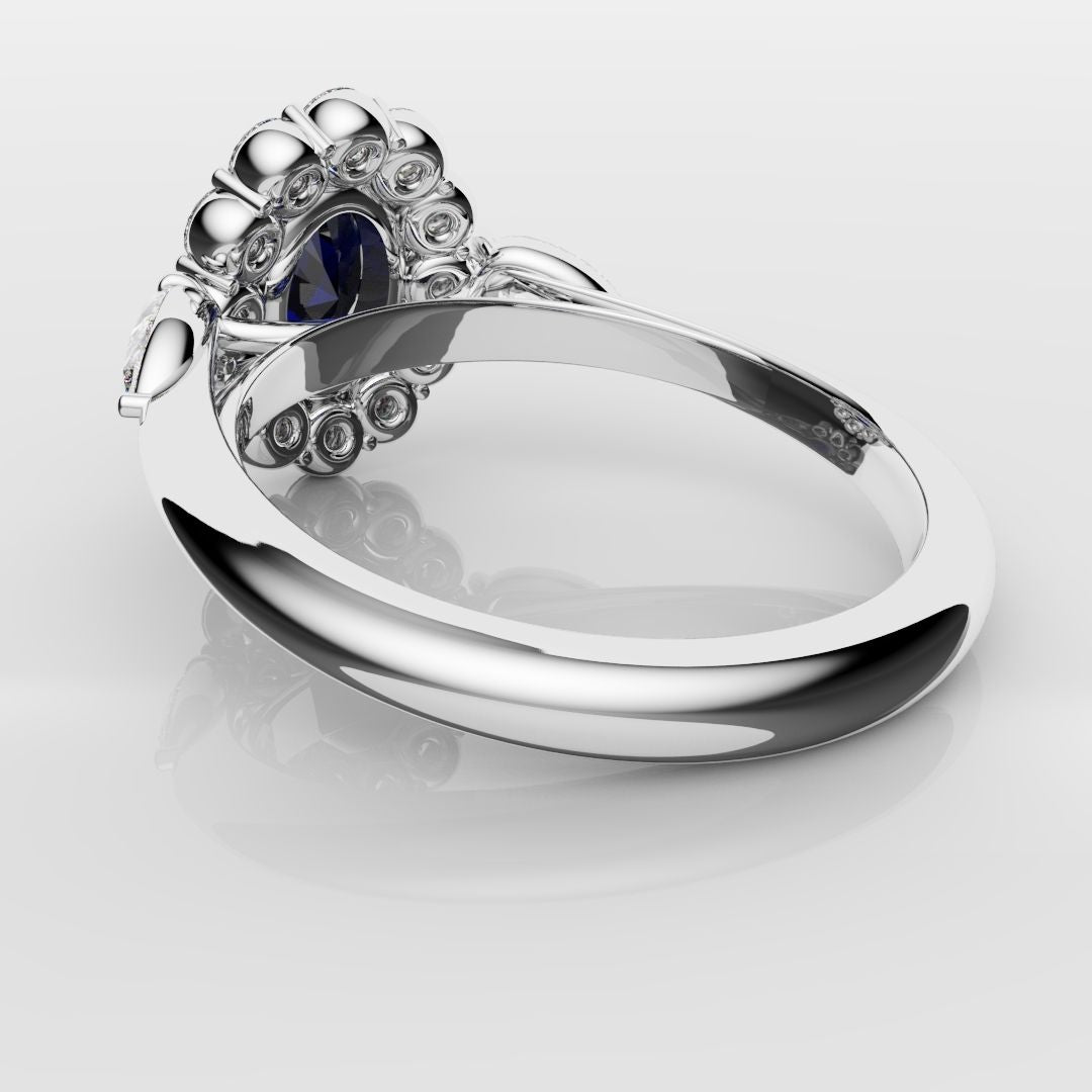 Oval Sapphire Cluster With Pear Shoulder Diamonds