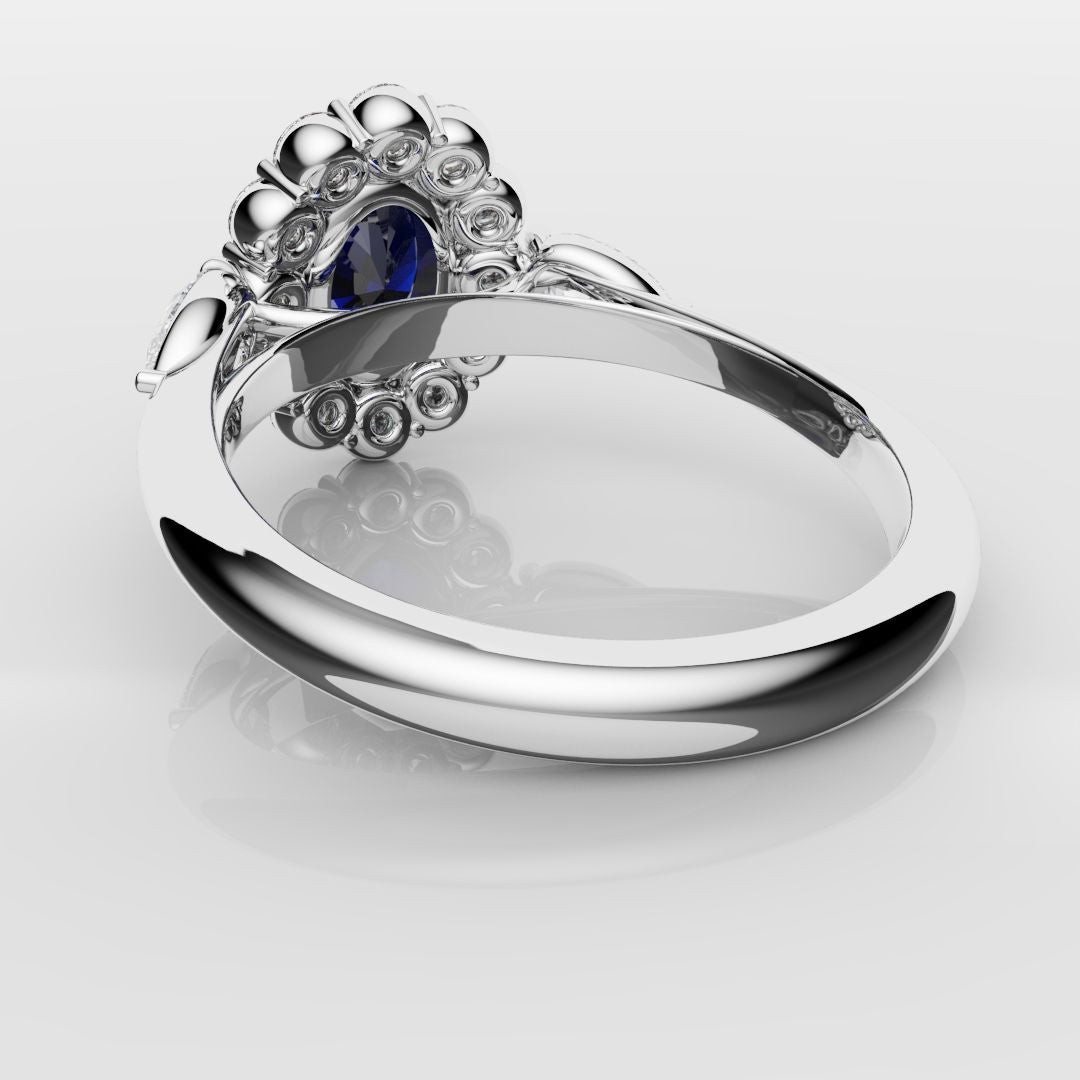 Oval Sapphire Cluster With Pear Shoulder Diamonds