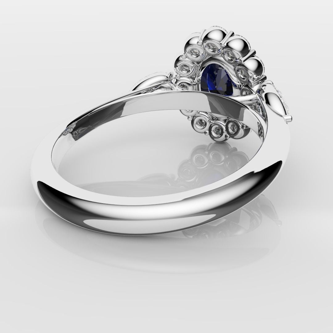 Oval Sapphire Cluster With Pear Shoulder Diamonds