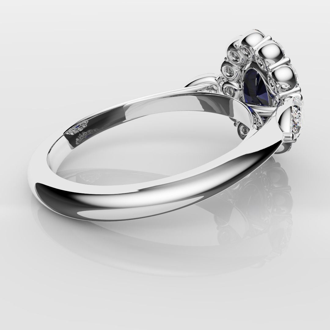 Oval Sapphire Cluster With Pear Shoulder Diamonds
