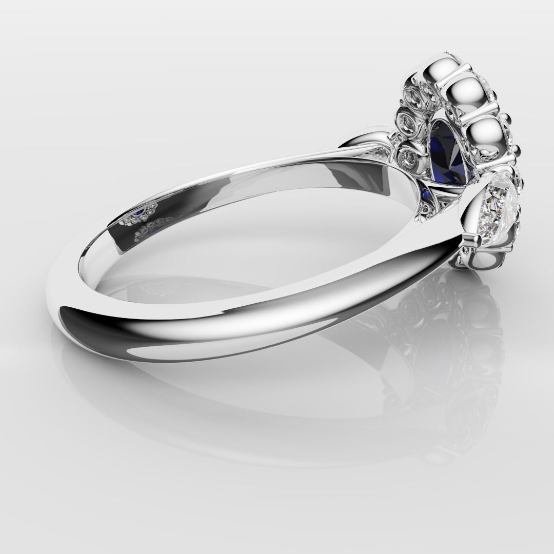 Oval Sapphire Cluster With Pear Shoulder Diamonds