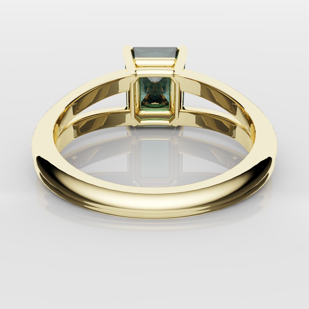 radiant cut teal sapphire engagement ring in yellow gold setting