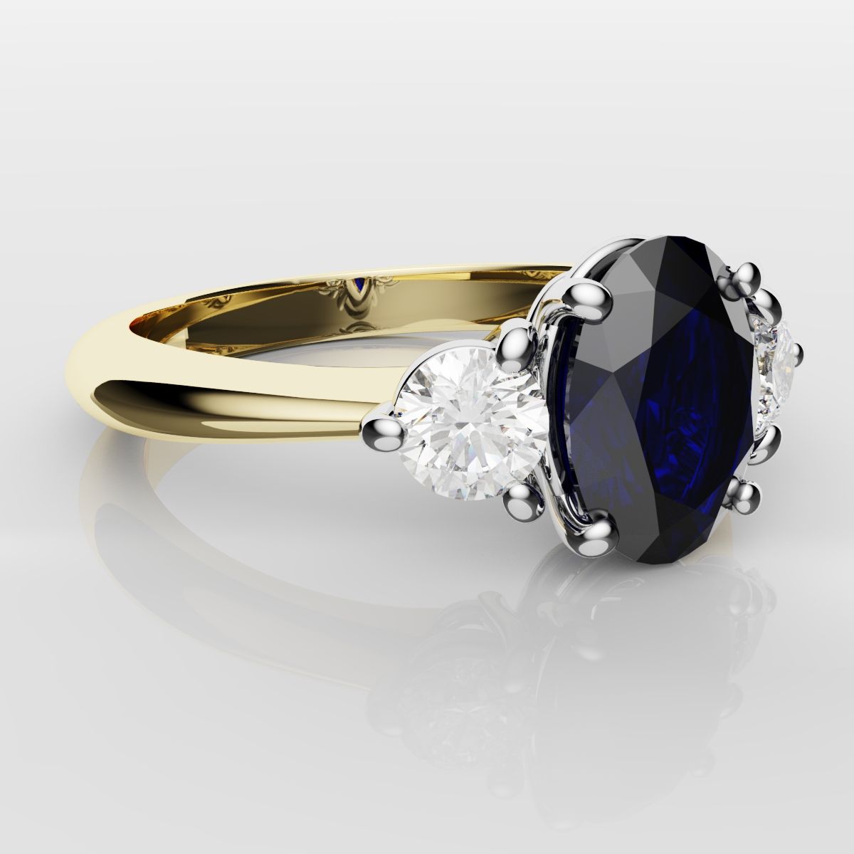 Oval Sapphire and Diamond Trilogy Engagement Ring