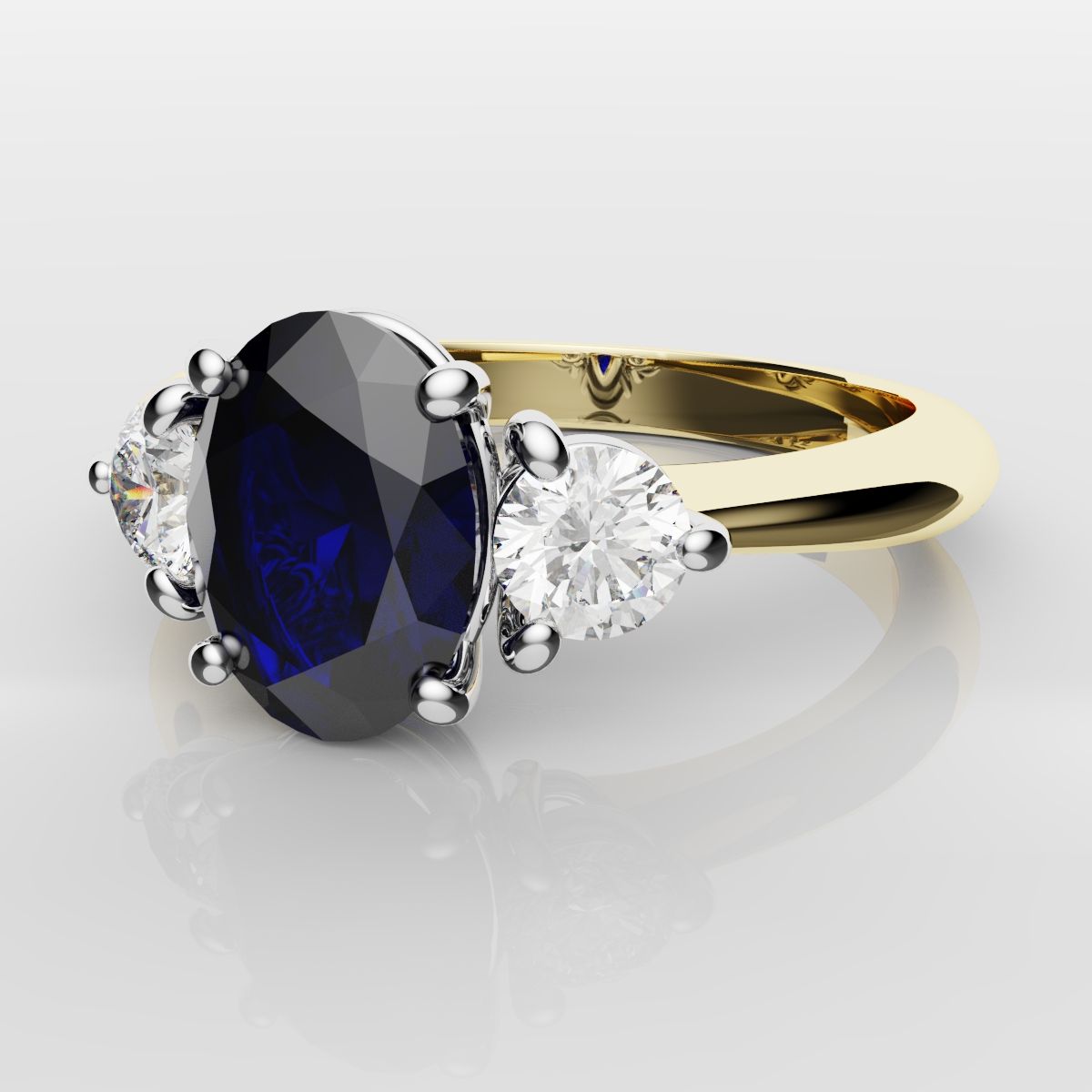 Oval Sapphire and Diamond Trilogy Engagement Ring