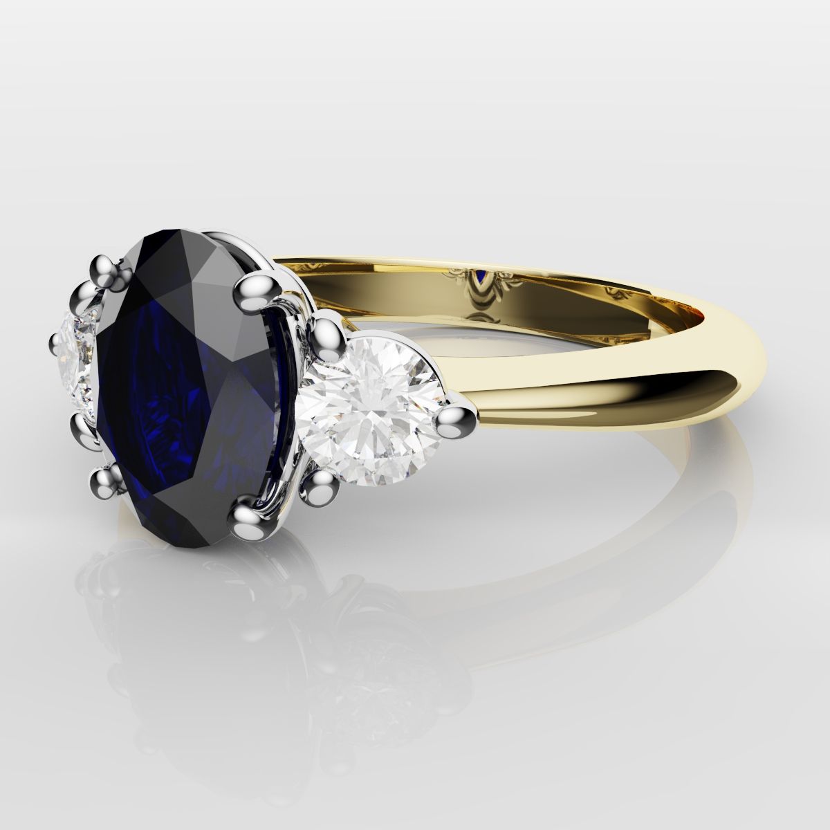 Oval Sapphire and Diamond Trilogy Engagement Ring