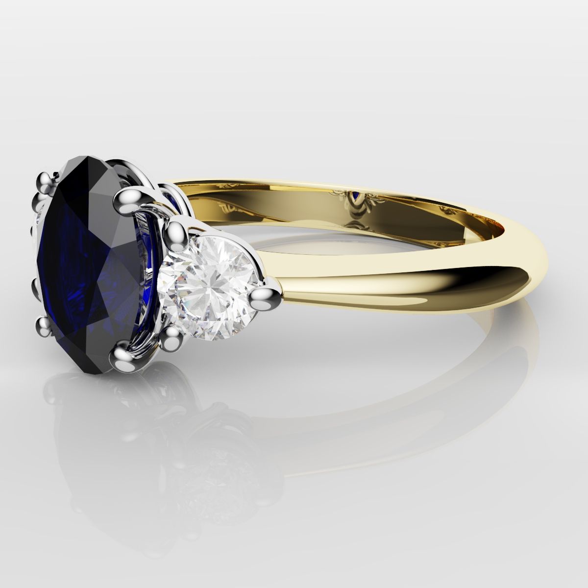 Oval Sapphire and Diamond Trilogy Engagement Ring