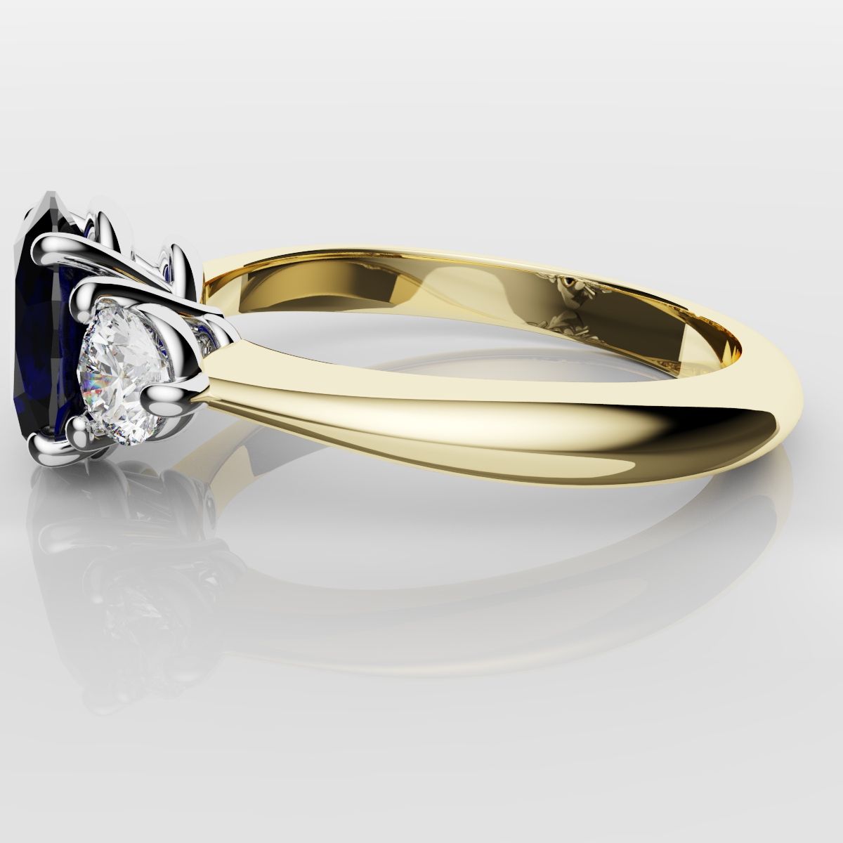 Oval Sapphire and Diamond Trilogy Engagement Ring