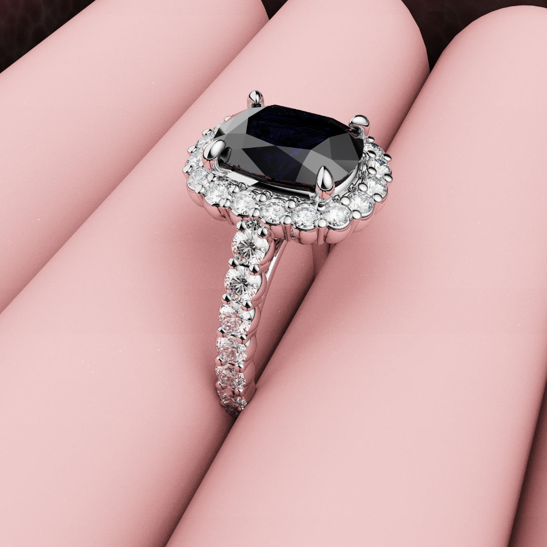 cushion cut blue sapphire halo engagement ring in platinum
