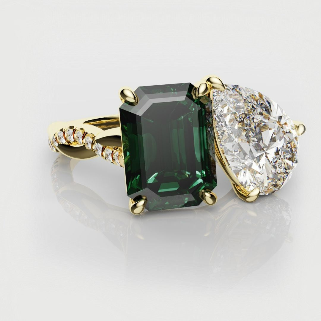 two stone emerald and diamond engagement ring
