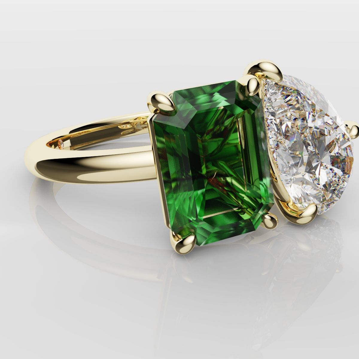 Emerald and Pear Diamond Two Stone Engagement Ring