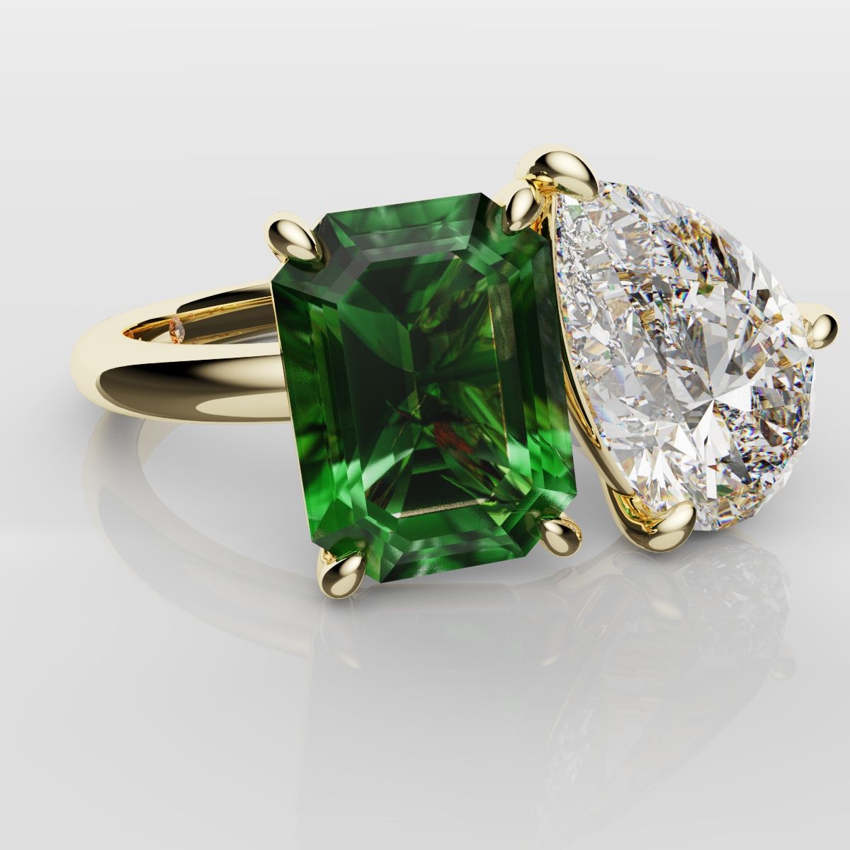 Emerald and Pear Diamond Two Stone Engagement Ring
