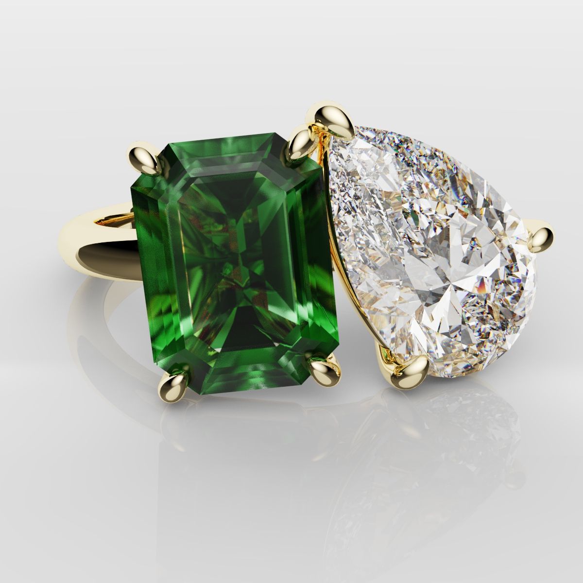 Emerald and Pear Diamond Two Stone Engagement Ring