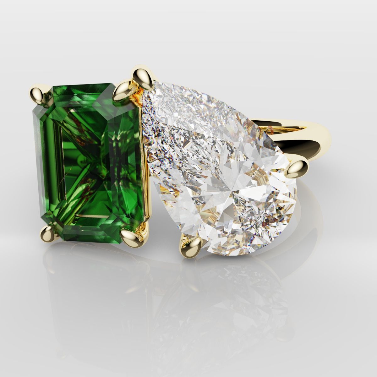 Emerald and Pear Diamond Two Stone Engagement Ring