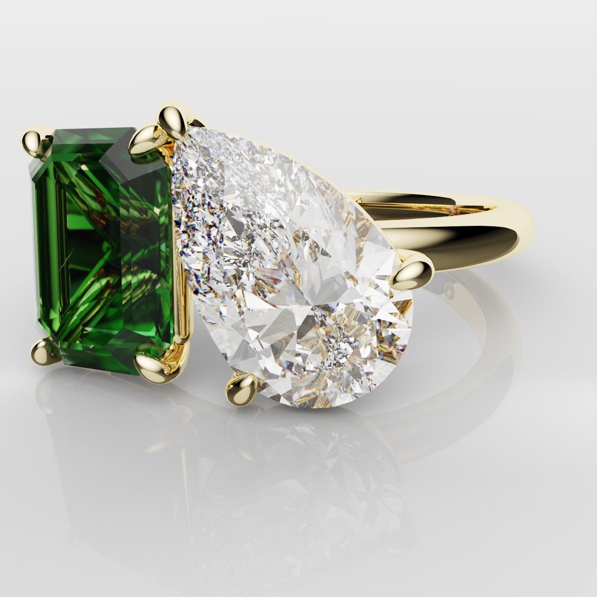 Emerald and Pear Diamond Two Stone Engagement Ring