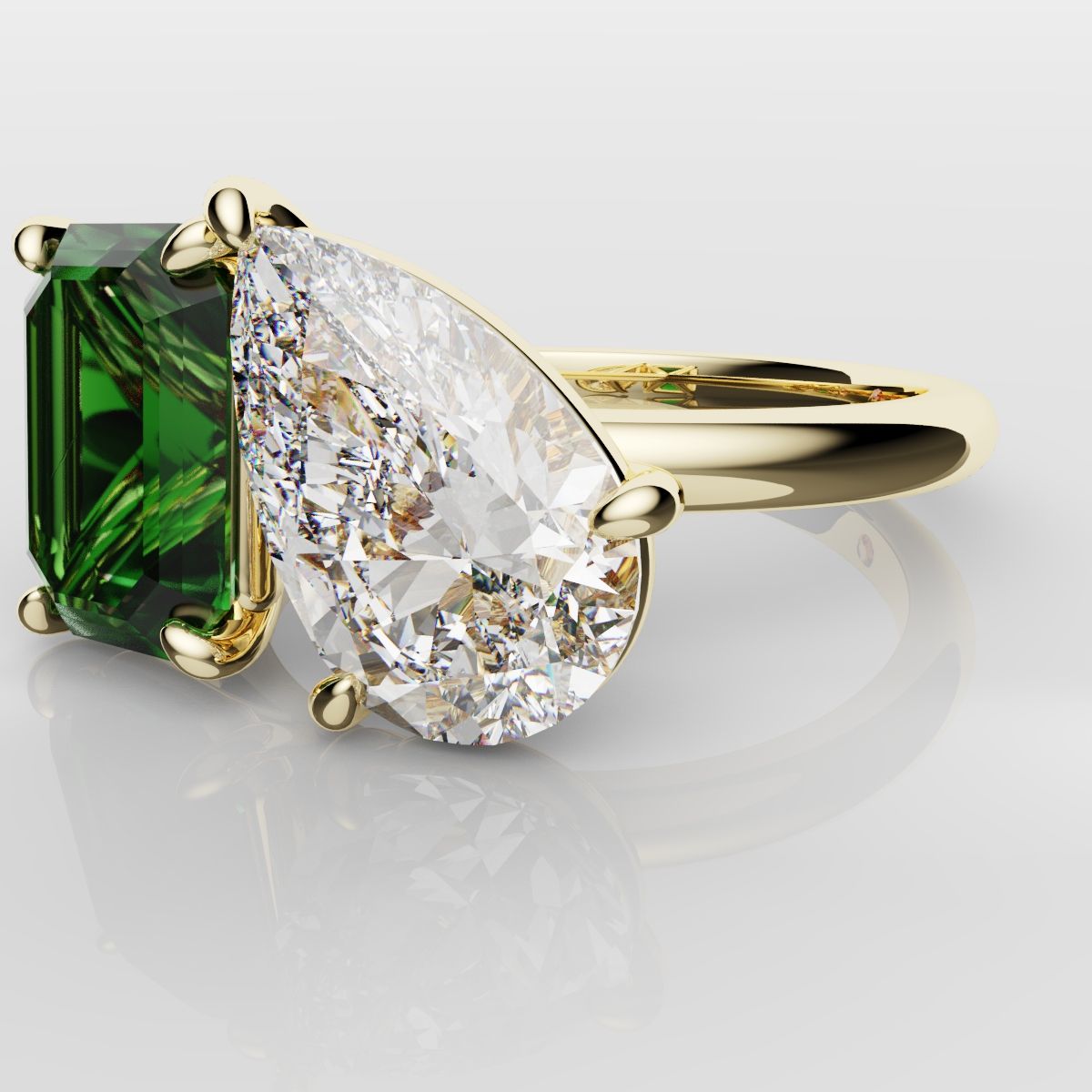 Emerald and Pear Diamond Two Stone Engagement Ring