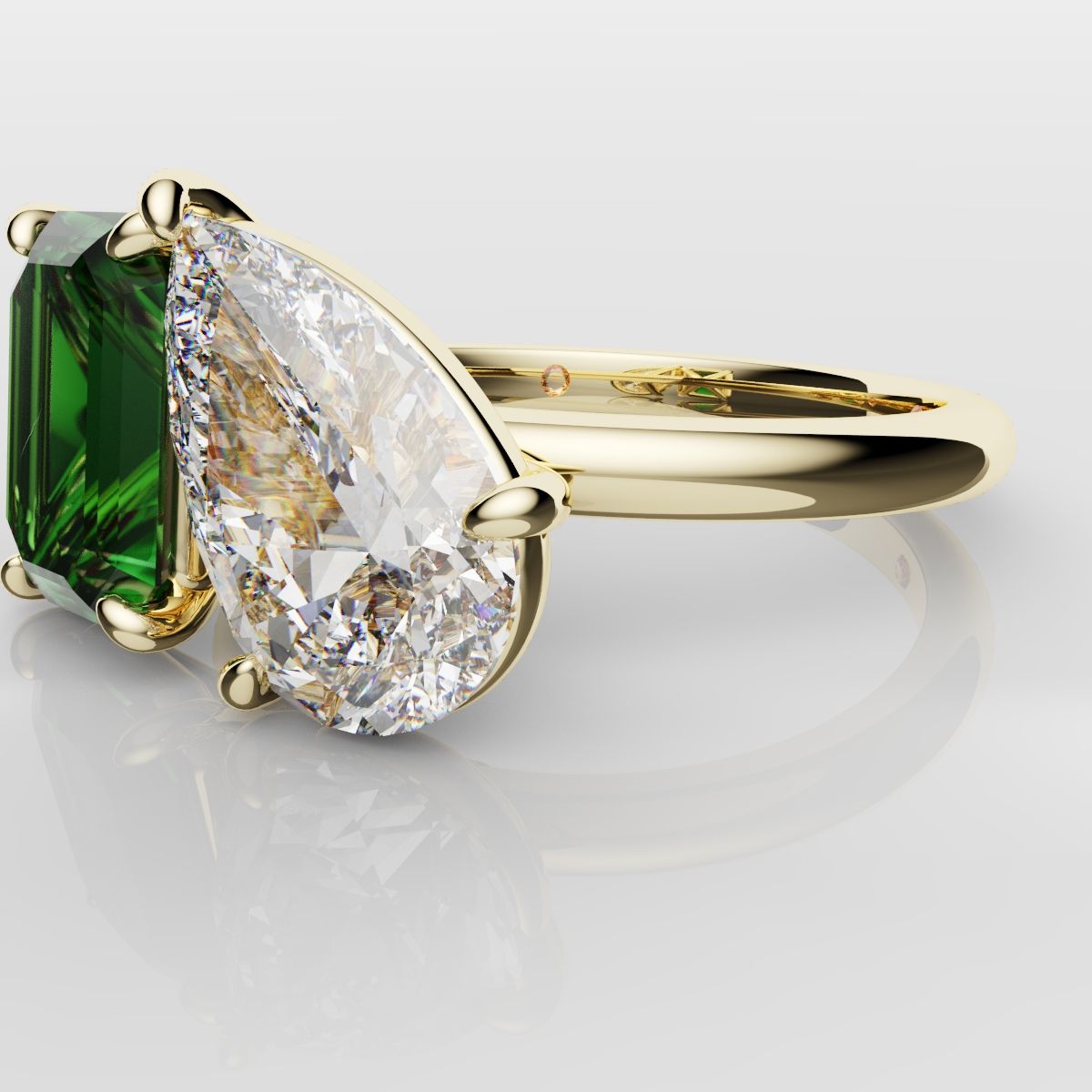 Emerald and Pear Diamond Two Stone Engagement Ring