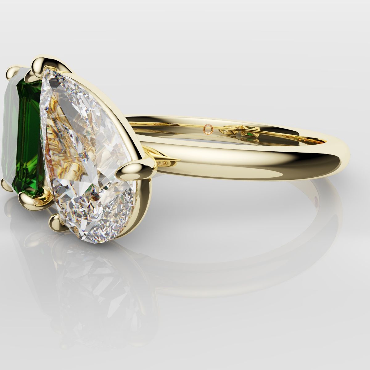 Emerald and Pear Diamond Two Stone Engagement Ring