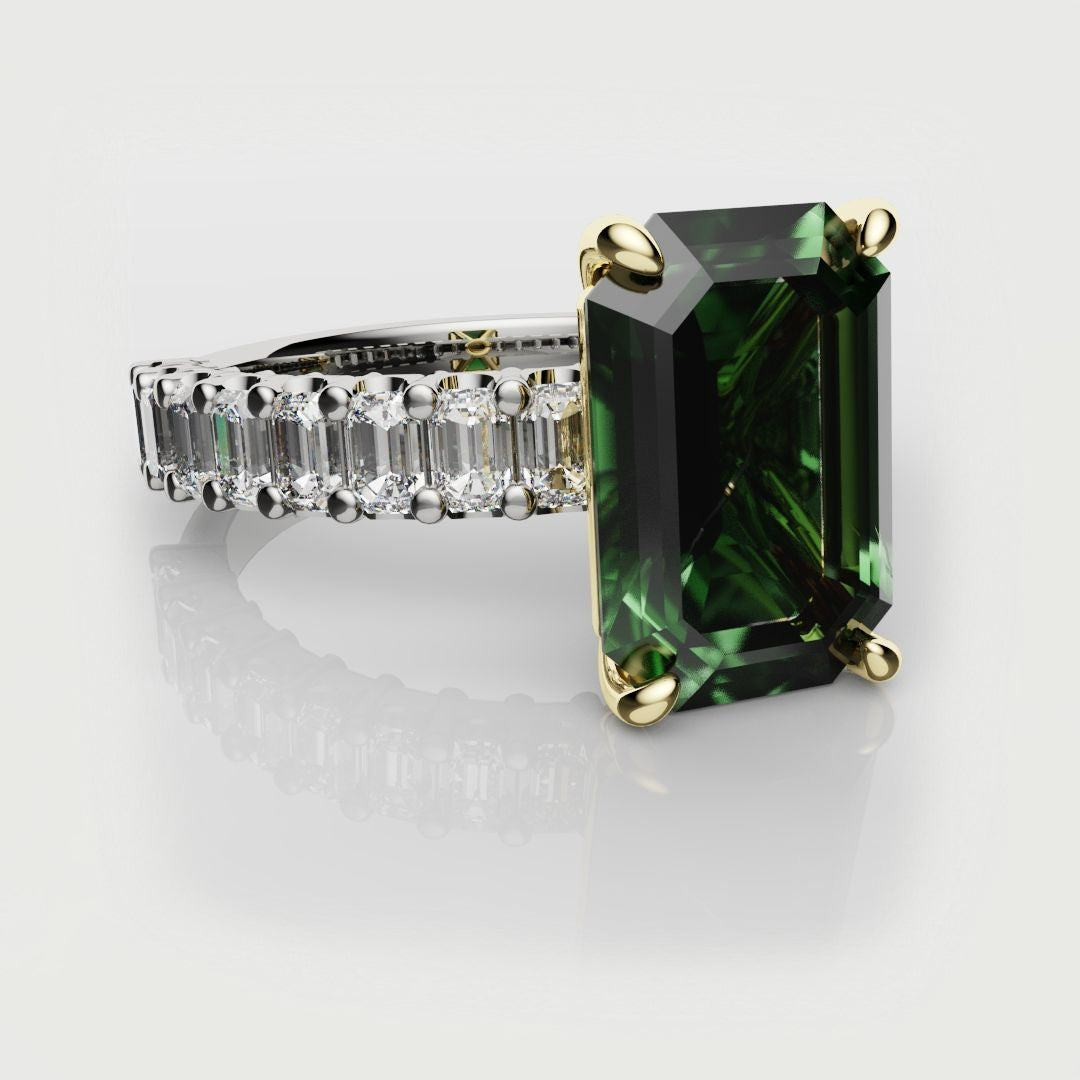 green emerald engagement ring adorned with a platinum shank featuring emerald cut diamonds