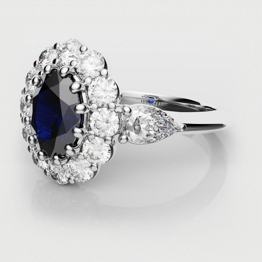 oval blue sapphire cluster engagement ring