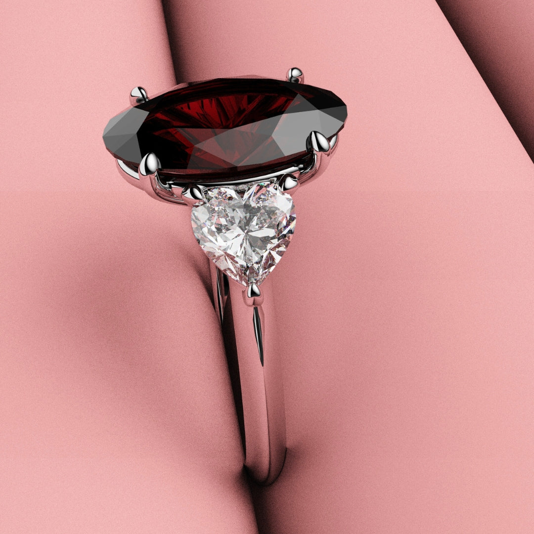 red ruby and heart shaped diamond three stone ring