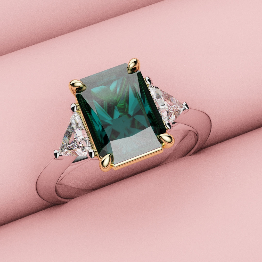 teal sapphire engagement ring with trilliant shoulder diamonds