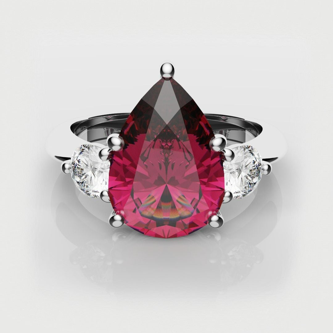 Pear shaped ruby trilogy engagement ring
