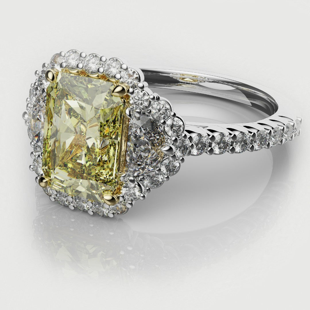 Fancy yellow radiant cut diamond ring with half-moon diamonds and a pavé halo, crafted in platinum — elegant bespoke engagement ring by Hyde Park Design.