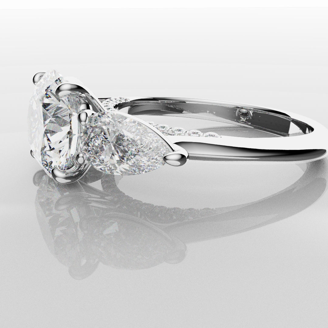 Round and Pear Trilogy Engagement Ring with Diamond Set Cathedral