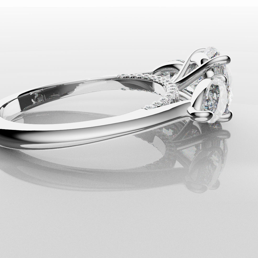 Round and Pear Trilogy Engagement Ring with Diamond Set Cathedral
