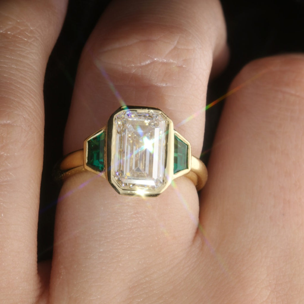 Emerald Cut Trilogy Engagement Ring With Green Emerald Trapezoids