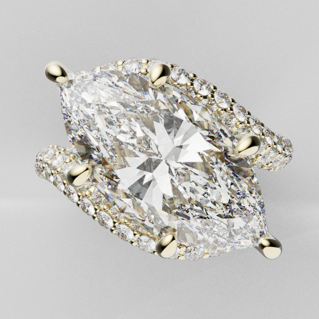 Luxury marquise-cut diamond ring featuring four-row micro pavé band and hidden halo, handcrafted in 18ct yellow gold.